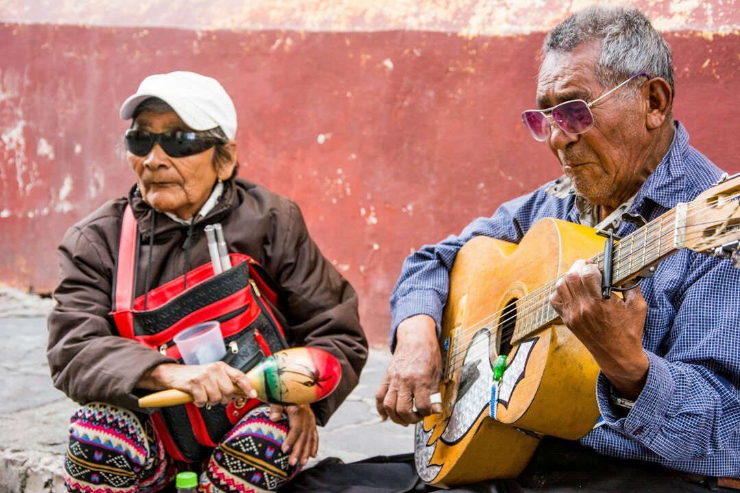 Older Mexican couple reviewing retirement plan documents