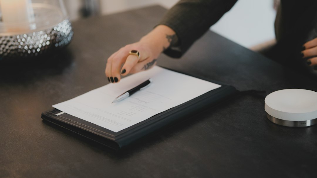 person signing insurance document